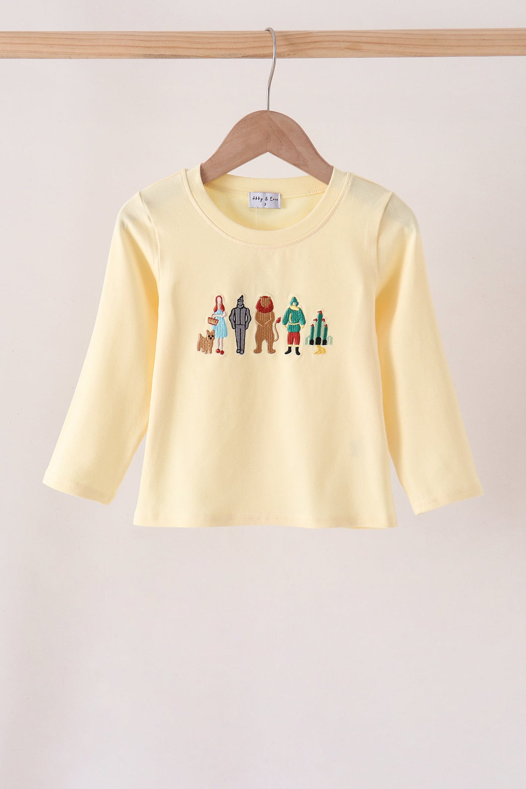 Beige character embroidery top