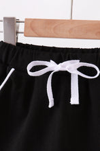 Black scallop hem bow skort