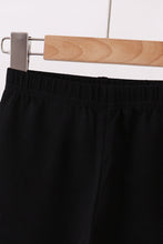 Black ruffle pants